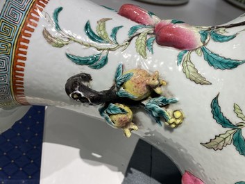 A Chinese famille rose molded 'nine peaches' vase, 19th C.